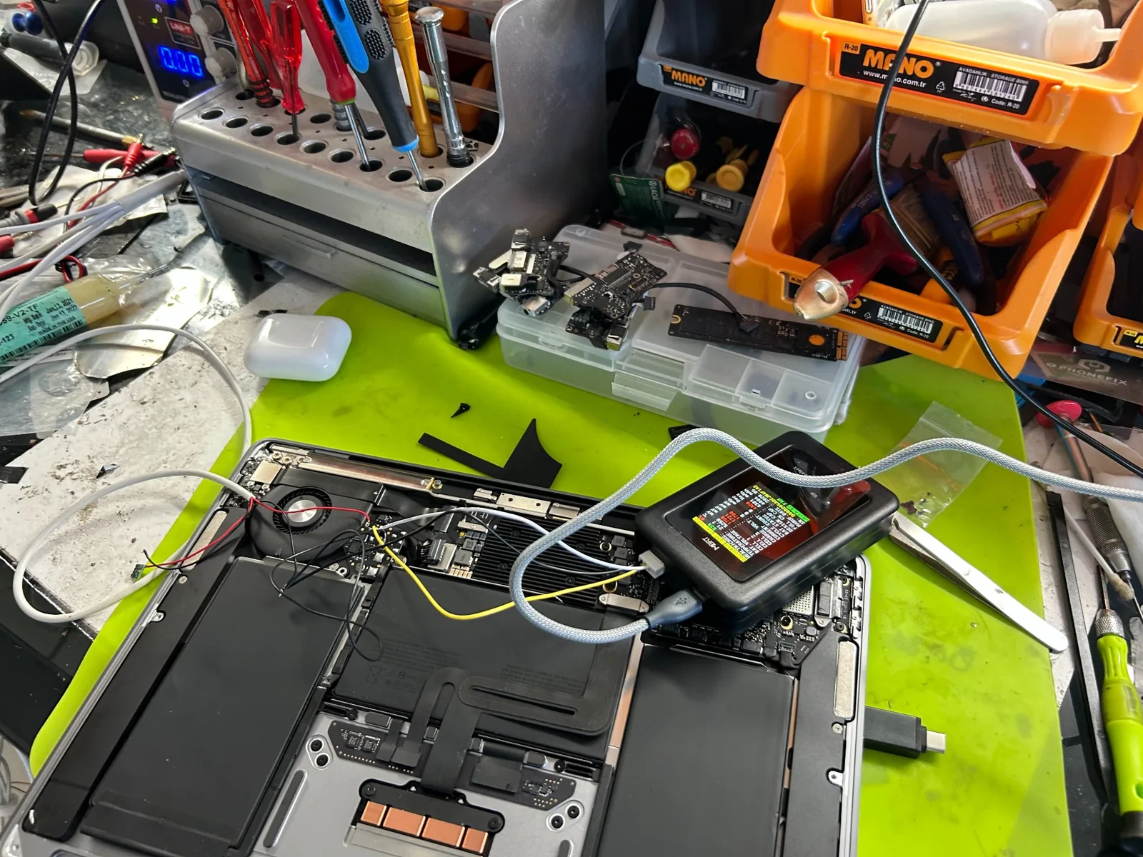 MacBook opened on the workbench
